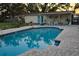 Sparkling in-ground pool and outdoor patio area, ideal for relaxation and entertainment at 406 2Nd Sw St, Ruskin, FL 33570