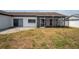 Spacious backyard with a patio and enclosed lanai area at 4435 Sail Dr, New Port Richey, FL 34652