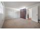 Spacious bedroom with plush carpeting, ample closet space, and a murphy bed at 4435 Sail Dr, New Port Richey, FL 34652