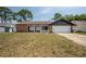 Charming single-Gathering home with brick accents and a manicured lawn at 4435 Sail Dr, New Port Richey, FL 34652
