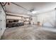 Attached garage featuring plenty of storage space and overhead lighting at 4435 Sail Dr, New Port Richey, FL 34652