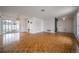 Open-concept living area with hardwood floors, and access to an outdoor patio at 4435 Sail Dr, New Port Richey, FL 34652