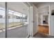 An enclosed patio provides an indoor-outdoor space and leads inside the house at 4435 Sail Dr, New Port Richey, FL 34652