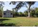 Large backyard with a storage shed and a mature tree at 4657 Parkway Blvd, Land O Lakes, FL 34639