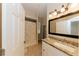 Bathroom featuring a large vanity, sink, framed mirror, and shower with curtain at 4657 Parkway Blvd, Land O Lakes, FL 34639