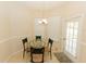 Bright breakfast nook with glass table, three chairs, and lots of natural light at 4657 Parkway Blvd, Land O Lakes, FL 34639