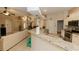 Bright, open kitchen with granite counters, stainless steel appliances, and seamless flow at 4657 Parkway Blvd, Land O Lakes, FL 34639