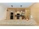 Open kitchen with granite countertops, stainless steel appliances, and pendant lighting at 4657 Parkway Blvd, Land O Lakes, FL 34639