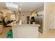 Modern kitchen with granite countertop bar, stainless appliances, and an open layout at 4657 Parkway Blvd, Land O Lakes, FL 34639
