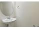 Elegant half-bathroom features a pedestal sink and modern fixtures at 5024 Sylvester Loop, Tampa, FL 33610