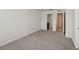 Spacious carpeted bedroom with connecting bathroom and hallway access, creating a convenient layout at 5024 Sylvester Loop, Tampa, FL 33610