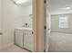 Convenient laundry area with a washer and dryer, located just off the bedroom space at 5024 Sylvester Loop, Tampa, FL 33610