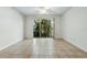 Bright, open living room showcasing a large glass door leading to the outdoor area at 5024 Sylvester Loop, Tampa, FL 33610