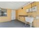 Carport featuring yellow walls, sink, and countertop at 5027 Overton Dr, New Port Richey, FL 34652