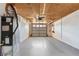A large garage space with painted walls and concrete floors at 5027 Overton Dr, New Port Richey, FL 34652