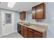 Stylish kitchen with wood cabinets, granite countertops, and updated appliances, perfect for cooking and entertaining at 5027 Overton Dr, New Port Richey, FL 34652