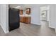 Galley kitchen featuring stainless steel appliances, granite counters, and wood cabinetry at 5027 Overton Dr, New Port Richey, FL 34652