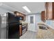 Well-lit kitchen featuring wood cabinets, stainless steel appliances, and light countertops at 5027 Overton Dr, New Port Richey, FL 34652