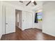 Bedroom featuring hardwood floors, closet, and abundant natural light at 511 Roanoke St, Dunedin, FL 34698