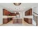Gourmet kitchen features stainless steel appliances, dark wood cabinets, and center island at 511 Roanoke St, Dunedin, FL 34698