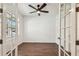 Bright office space with hardwood floors, a ceiling fan, and natural light at 511 Roanoke St, Dunedin, FL 34698