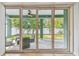 View of outdoor patio through sliding glass doors at 511 Roanoke St, Dunedin, FL 34698