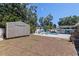Backyard shed, pool, and patio area is perfect for outdoor entertaining at 5201 108Th N St, St Petersburg, FL 33708