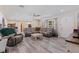 Bright living room featuring luxury seating, ceiling fan, and contemporary decor at 5201 108Th N St, St Petersburg, FL 33708