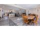 Open-concept living space with hardwood flooring, dining area, kitchen and access to the backyard at 5201 108Th N St, St Petersburg, FL 33708