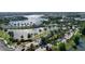 Aerial view of gated community with shimmering lakes, lush landscaping, and palm tree lined streets at 5225 Brighton Shore Dr, Apollo Beach, FL 33572