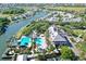 Aerial view of a waterfront community with a large pool, clubhouse, and private boat docks at 5225 Brighton Shore Dr, Apollo Beach, FL 33572