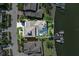 Aerial view of home featuring backyard pool, and boat dock on the water at 5225 Brighton Shore Dr, Apollo Beach, FL 33572