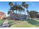 Manicured backyard with large screened in lanai with pool and waterfall feature at 5225 Brighton Shore Dr, Apollo Beach, FL 33572