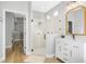 Bathroom with a glass enclosed shower, vanity, and view into the walk-in closet at 5225 Brighton Shore Dr, Apollo Beach, FL 33572