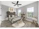 Whimsical bedroom features hardwood floors, bright decor, and windows for natural light at 5225 Brighton Shore Dr, Apollo Beach, FL 33572