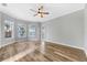 Bright bedroom with large windows overlooking the water and wood flooring at 5225 Brighton Shore Dr, Apollo Beach, FL 33572