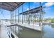 Large covered boat lift structure on the water with a view of surrounding waterfront properties at 5225 Brighton Shore Dr, Apollo Beach, FL 33572