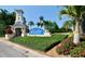 Welcoming entrance to the MiraBay community with lush landscaping and clear blue sky at 5225 Brighton Shore Dr, Apollo Beach, FL 33572