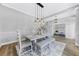 Charming dining room with a rustic table, stylish light fixture, and hardwood floors at 5225 Brighton Shore Dr, Apollo Beach, FL 33572