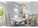 Inviting dining room with large windows, stylish lighting, and a comfortable dining set at 5225 Brighton Shore Dr, Apollo Beach, FL 33572