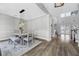 Bright dining room with an elegant table set, stylish lighting, and hardwood flooring at 5225 Brighton Shore Dr, Apollo Beach, FL 33572