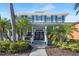 Stunning two-story home with lush landscaping, stately columns, and a welcoming entrance at 5225 Brighton Shore Dr, Apollo Beach, FL 33572