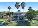Spacious backyard with a screened-in pool featuring a rock waterfall at 5225 Brighton Shore Dr, Apollo Beach, FL 33572