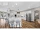 Modern kitchen with stainless steel appliances, white cabinets, marble countertops, and a breakfast bar with seating at 5225 Brighton Shore Dr, Apollo Beach, FL 33572