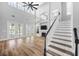 Spacious living room with high ceilings, large windows, a fireplace and staircase at 5225 Brighton Shore Dr, Apollo Beach, FL 33572