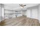Large loft with hardwood style floors and railing overlooking the lower level at 5225 Brighton Shore Dr, Apollo Beach, FL 33572