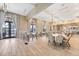 Spacious meeting room with ample seating, chandeliers, neutral walls, and plenty of windows for natural light at 5225 Brighton Shore Dr, Apollo Beach, FL 33572
