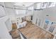 Open floor plan featuring a modern kitchen, dining area, and French doors to the pool at 5225 Brighton Shore Dr, Apollo Beach, FL 33572