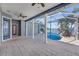Undercover patio area with an outdoor pool and view of the water at 5225 Brighton Shore Dr, Apollo Beach, FL 33572
