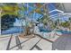 Enclosed pool area with lovely rock waterfall and view of the serene waterfront setting at 5225 Brighton Shore Dr, Apollo Beach, FL 33572